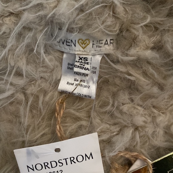 NEW WITH TAGS. Really cute reversible cream colored faux fur vest. XS - Picture 2 of 4